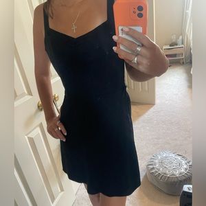 Simple and classy black open back dress